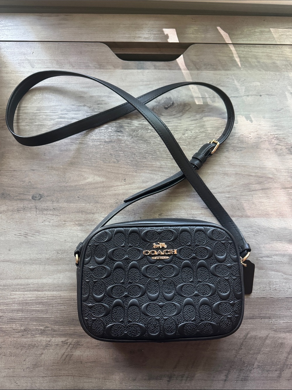 Coach Black leather Embossed Signature Crossbody bag with Gold Logo NWT